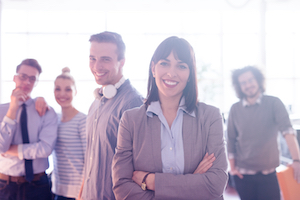 small business owner with employees in the background